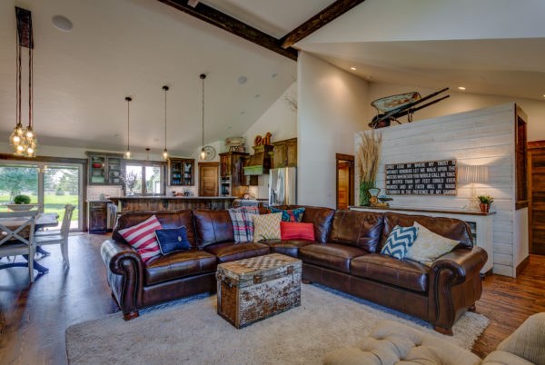 Restored great room with vaulted wood ceiling