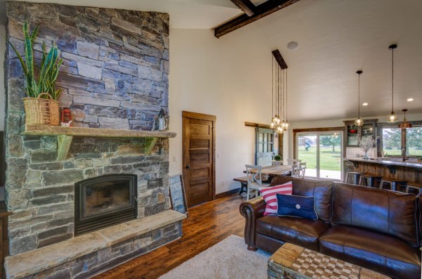 Restored living room with stone fireplace