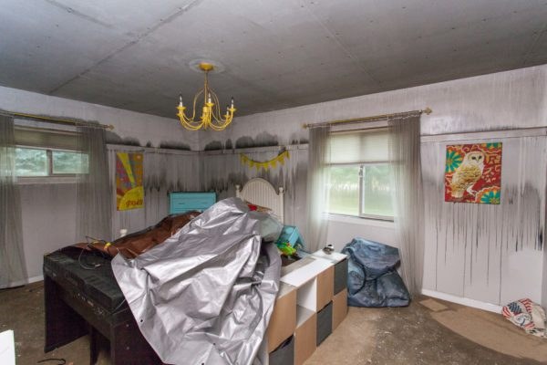 Smoke-damaged bedroom before restoration