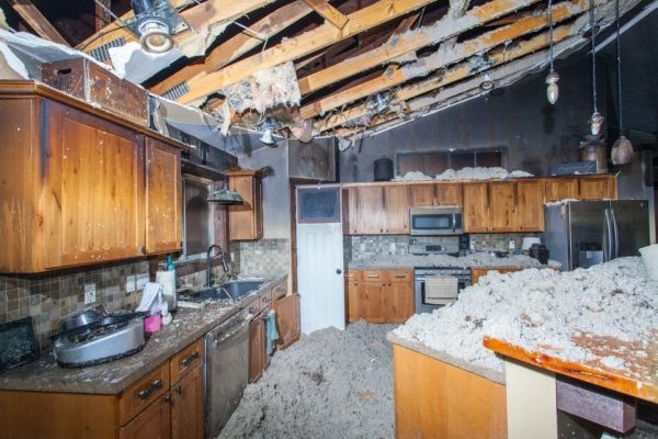 Fire-damaged kitchen before restoration